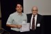 Dr. Nagib Callaos, General Chair, giving Dr. Andre F. S. Guedes the best paper award certificate of the session "Image, Optical and Cybernetics Technologies ." The title of the awarded paper is "New Optoelectronic Technology Simplified for Organic Light Emitting Diode (OLED)."